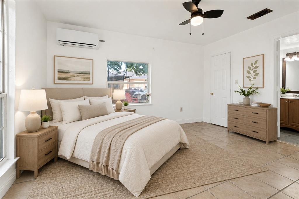 Bright room featuring tile flooring, a window, and a ceiling fan