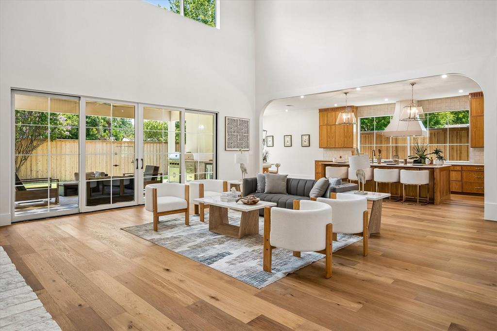 Living to patio view, two-story ceiling, open kitchen sight line