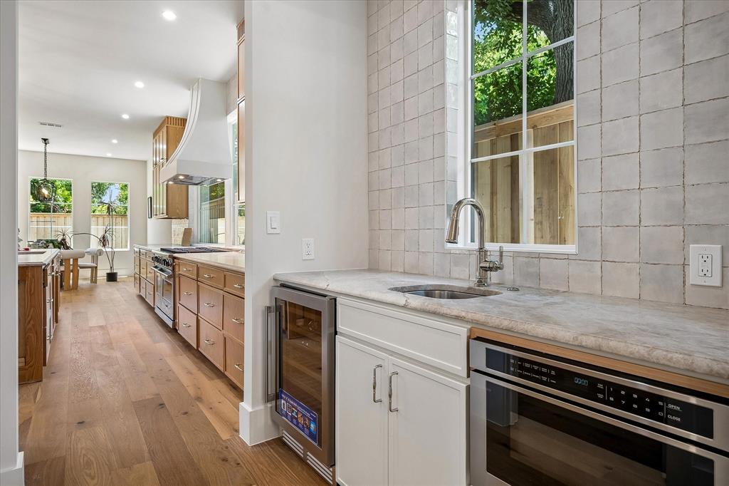 Prep kitchen, dedicated sink, beverage refrigerator, Mizu Silver tile backsplash, built-in microwave