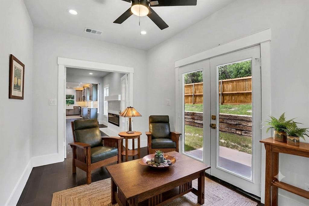 Bright interior space featuring wood-finish flooring, recessed lighting, and a ceiling fan