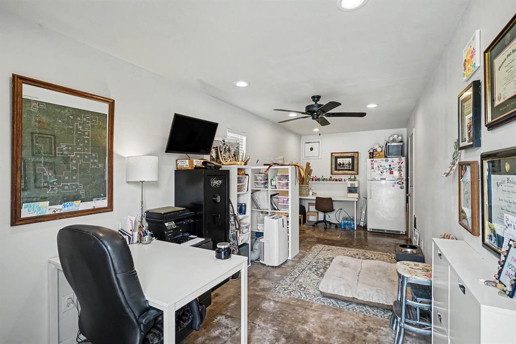 Office space attached to the 3 car garage. Concrete floors,  exhaust fan for commercial grade oven or workshop.