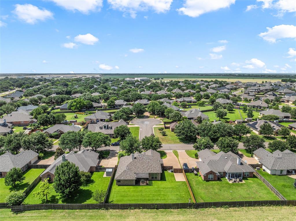 Expansive residential community featuring a variety of single-story homes with mature trees and manicured lawns