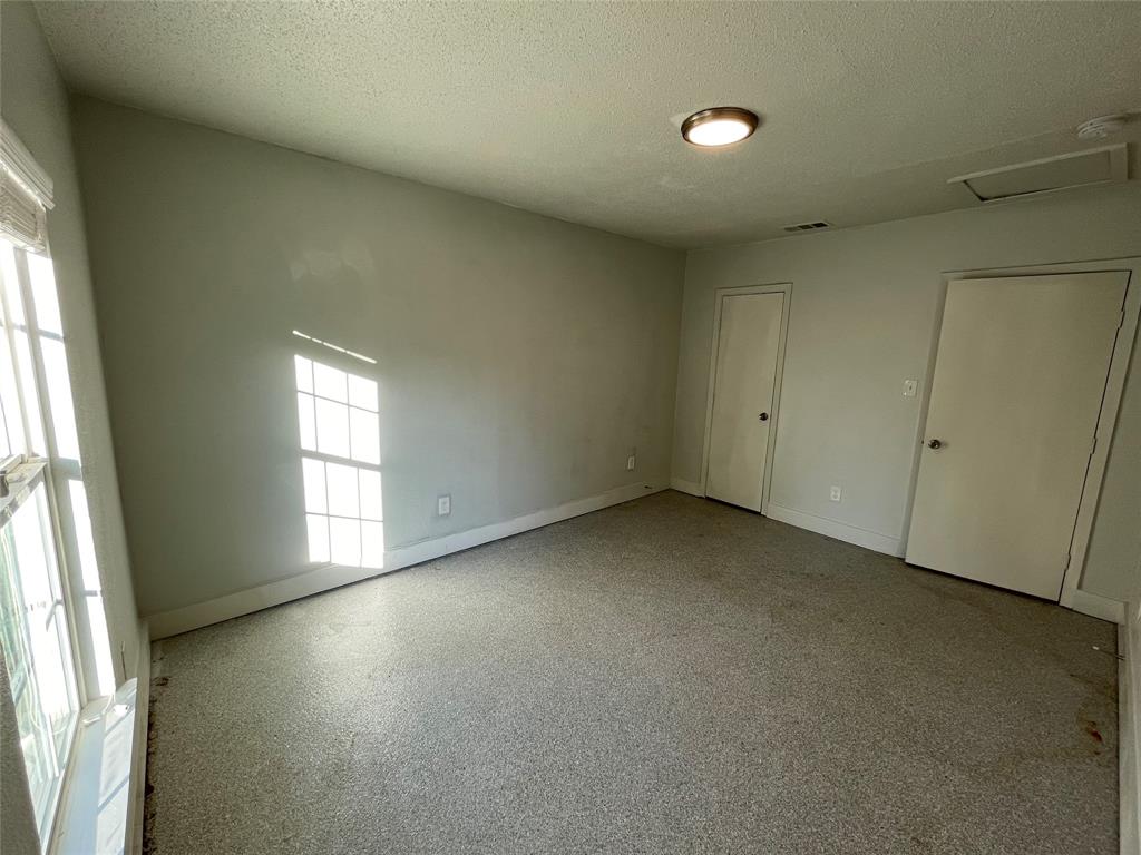Spare room with a textured ceiling