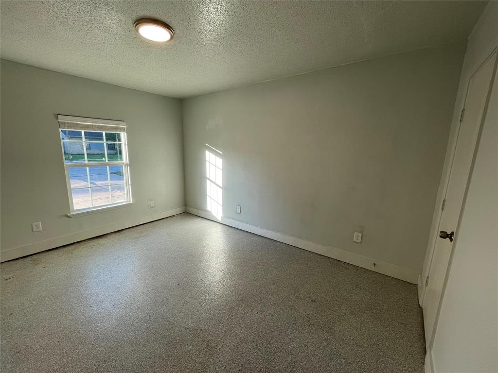 Spare room featuring a textured ceiling