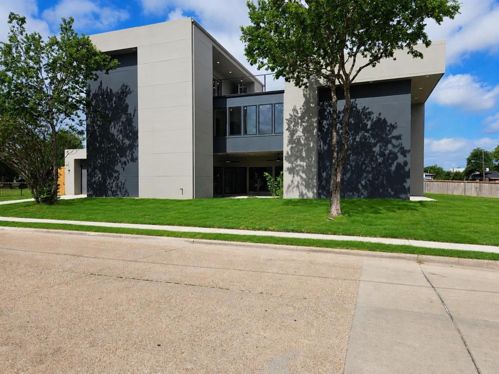 Contemporary exterior featuring a multi-story design with a flat roofline