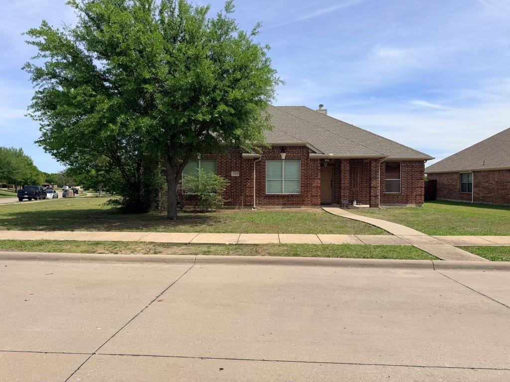 Brick exterior with a gabled roof and covered front entry Brick exterior with a gabled roof and covered front entry