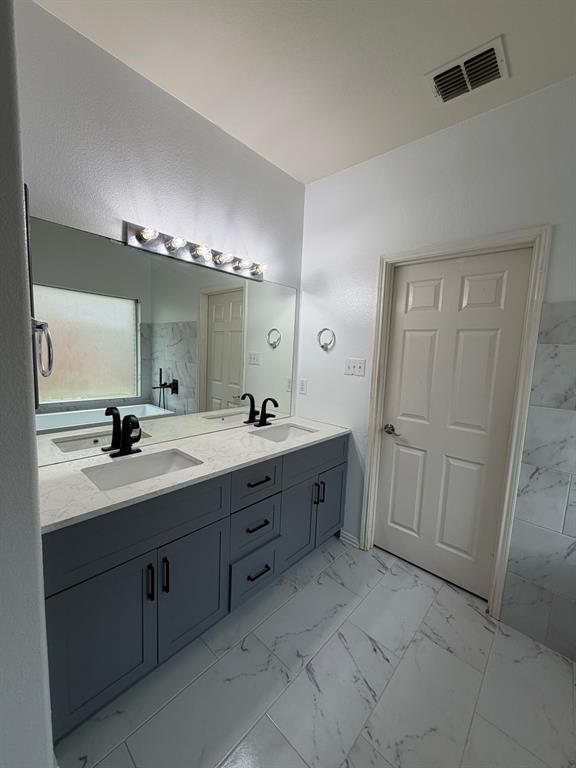 Dual vanity with white quartz countertop and integrated rectangular sinks