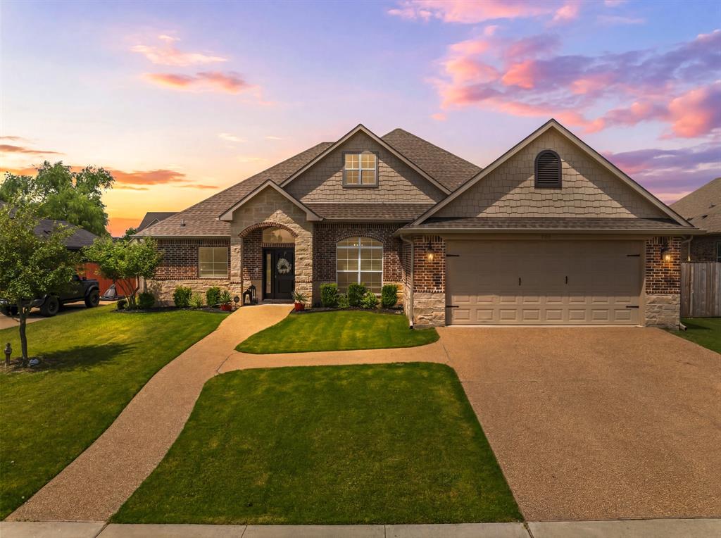 Brick and stone-front home with a two-car garage