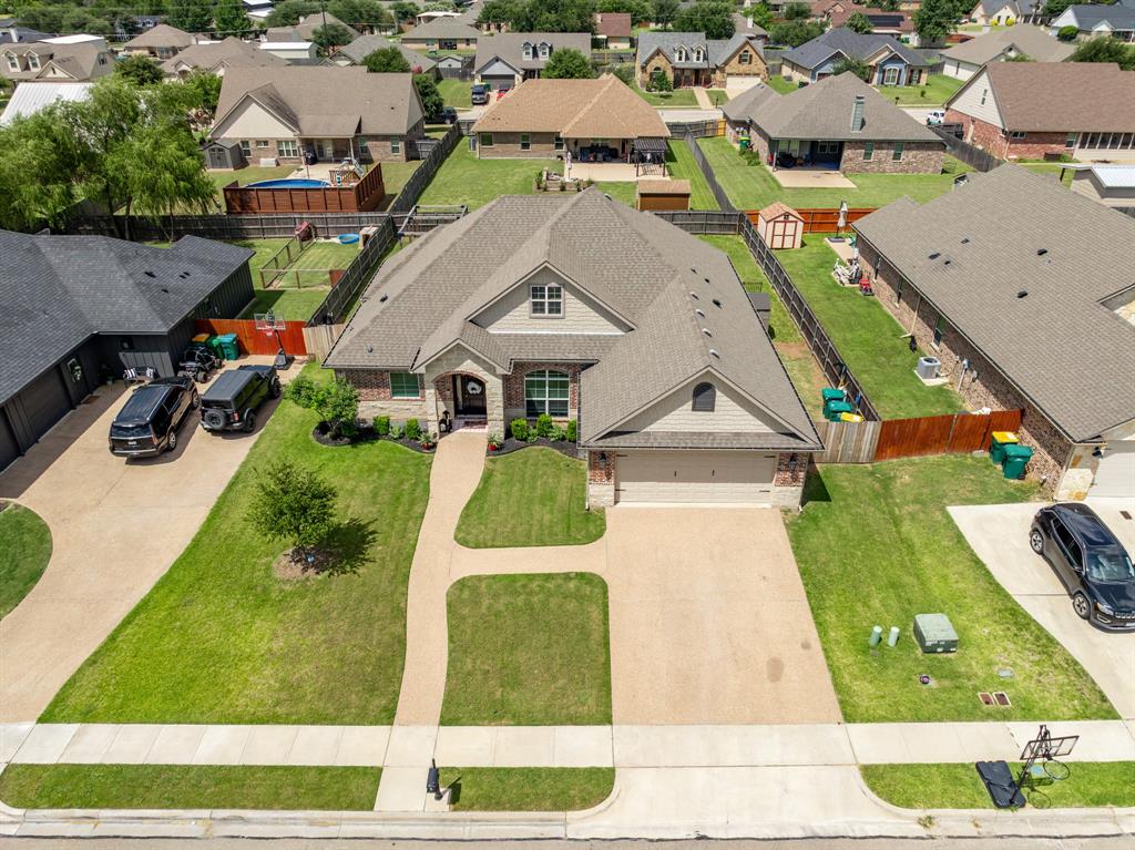 Traditional style residence featuring a brick and siding exterior, a gabled roofline, an attached two-car garage, and a concrete driveway