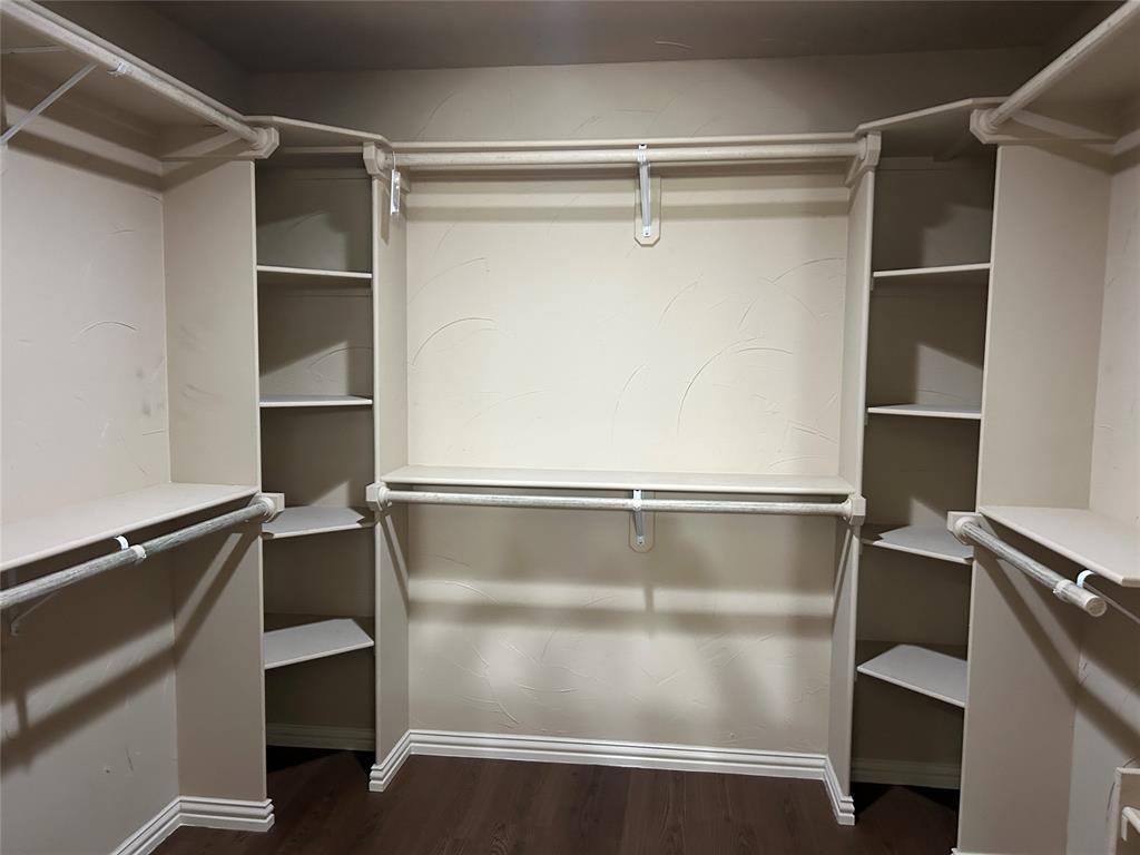 walk in closet in primary bedroom