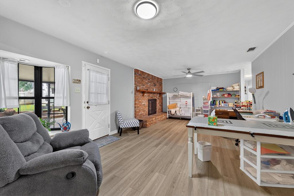 Breakfast nook and family room currently used for a craft space