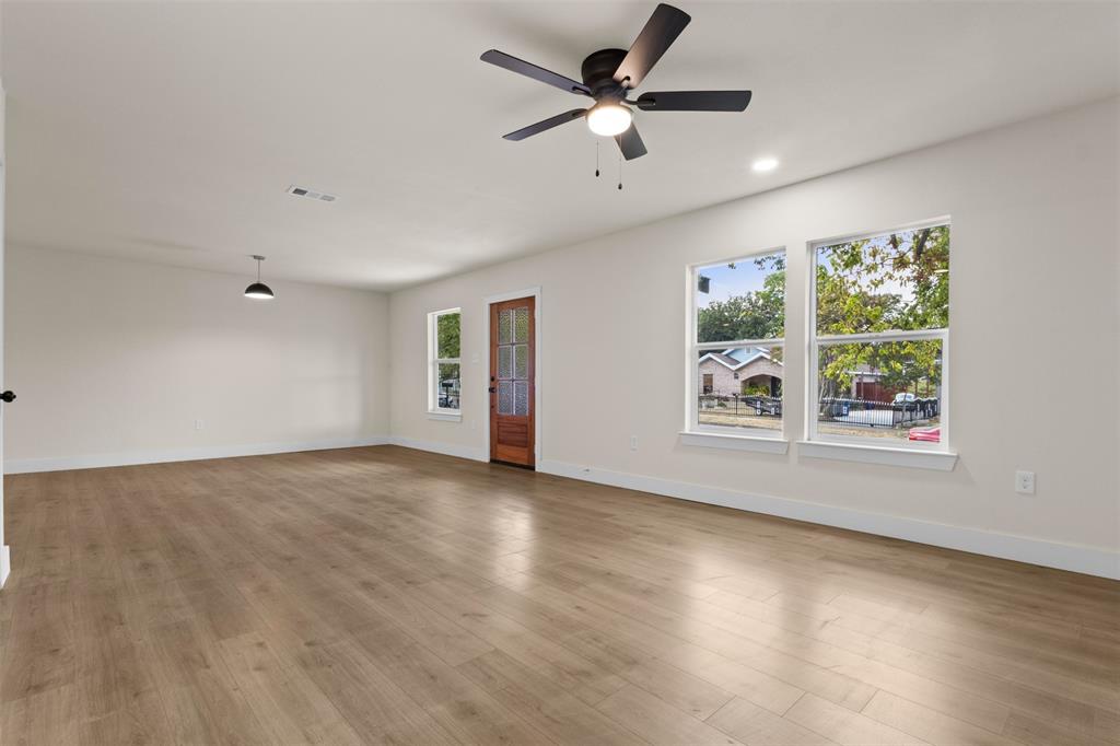 Wood-finish flooring, recessed lighting, and a modern ceiling fan