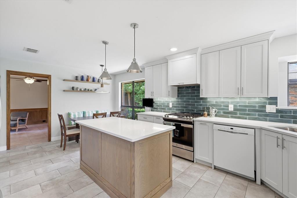 Cook with gas and allow the above vent to do it's job and vent to the outside.  The vent hood does open and allow for additional storage.