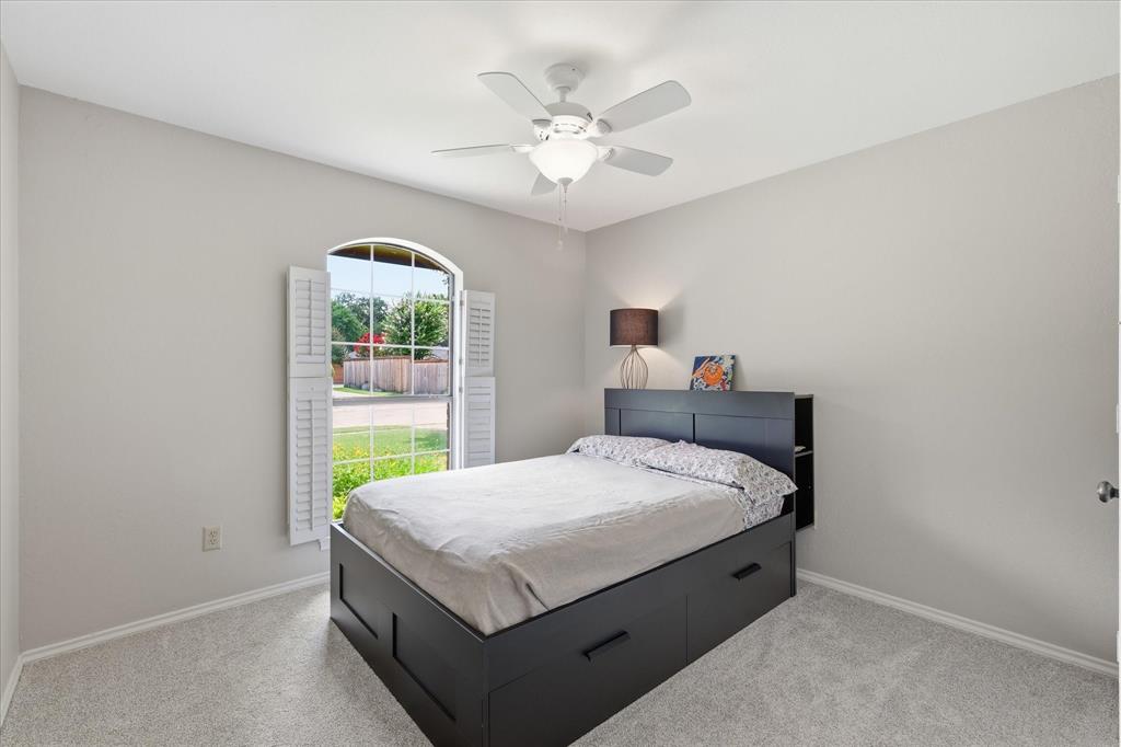 Bedroom 2.  In June this room was painted and new carpet was installed.  This room has a walk in closet and ceiling fan.  THe shutters were recently removed and 2 in blinds were added. This was done after pictures..