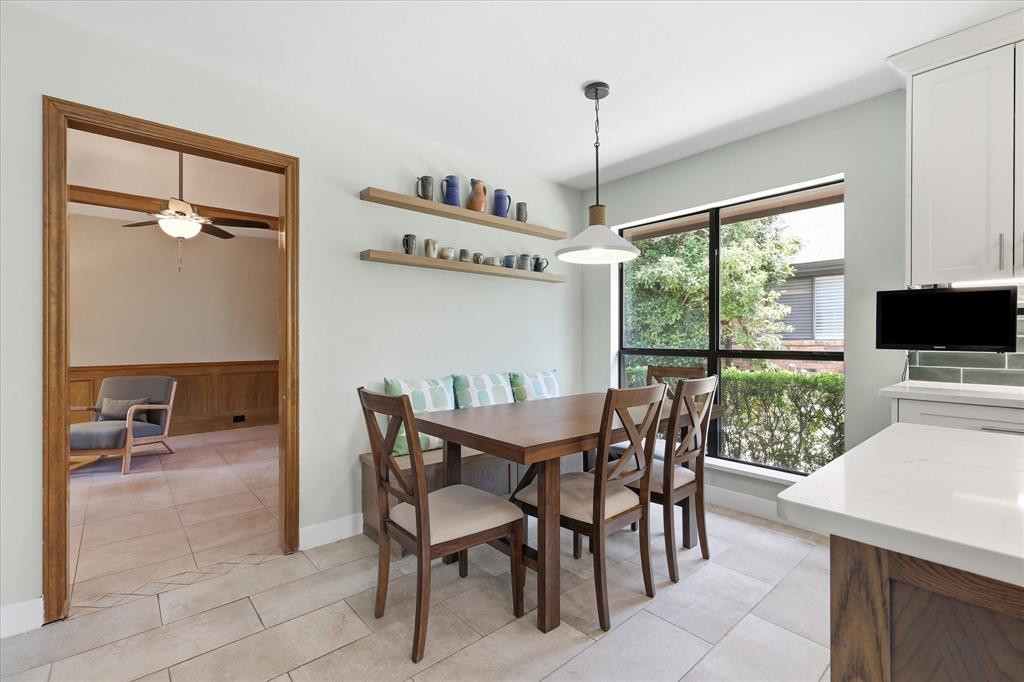 Breakfast area offers a storage bench and plenty of seating.