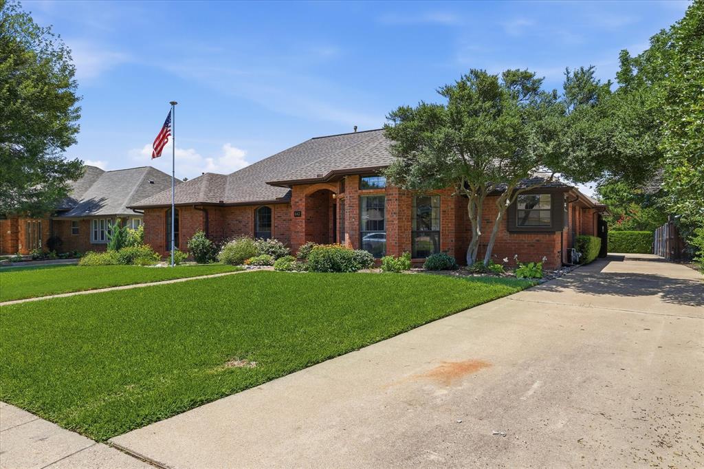 Long driveway with swing in parking in the back and an electric gate.