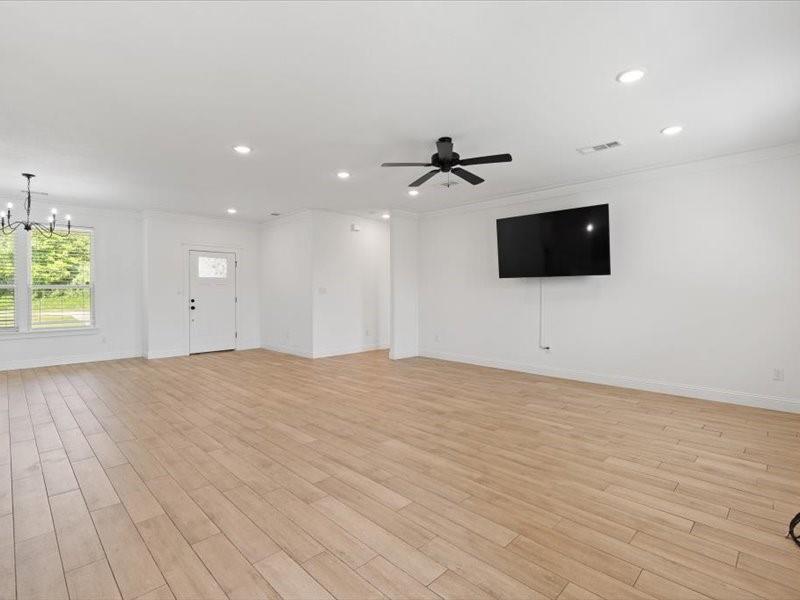 Spacious interior featuring wood-look tile flooring throughout