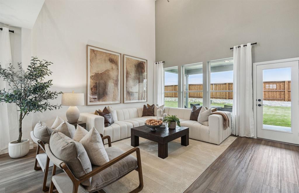 *Model Representation - Spacious gathering room with large windows