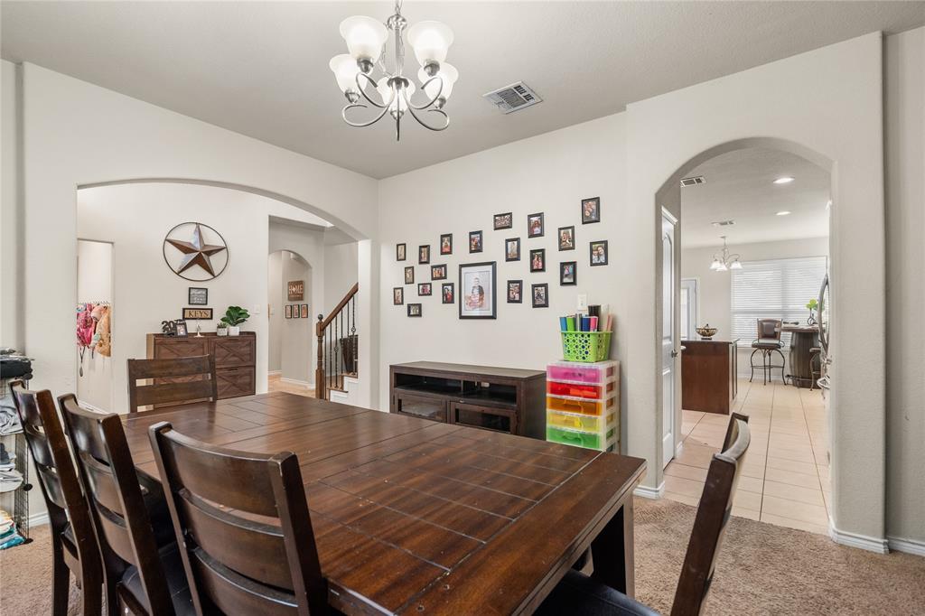 Dining area features arched doorways.