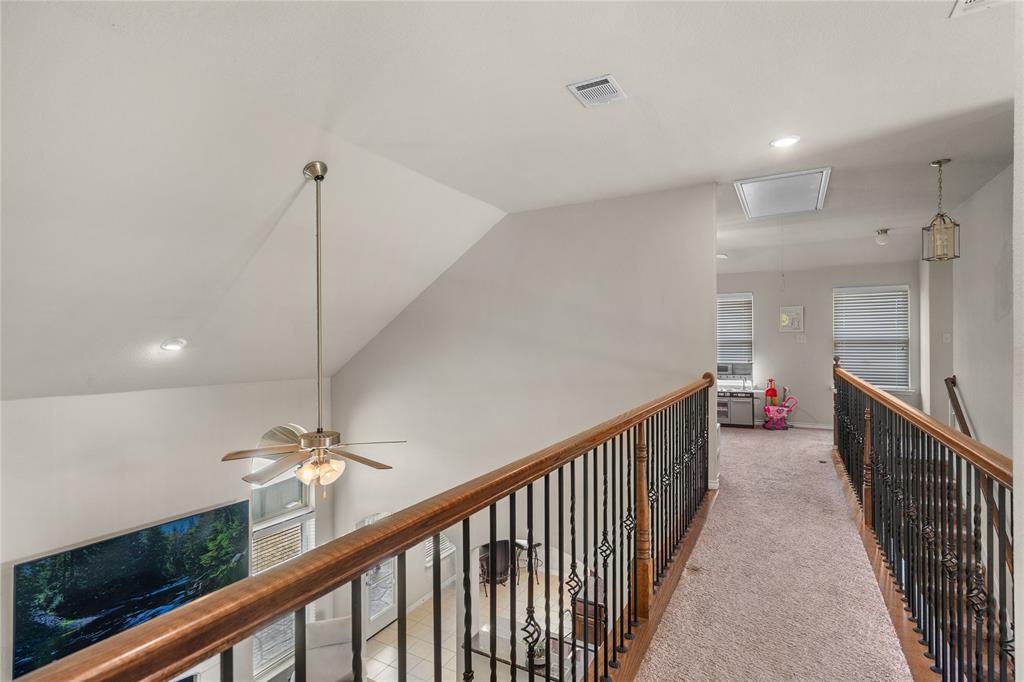Upstairs hall separates bedrooms and game rooms.