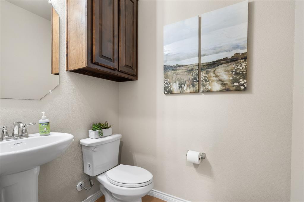 Powder room located downstairs.