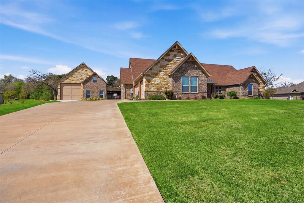 Huge driveway to both structures. Easy access to RV storage