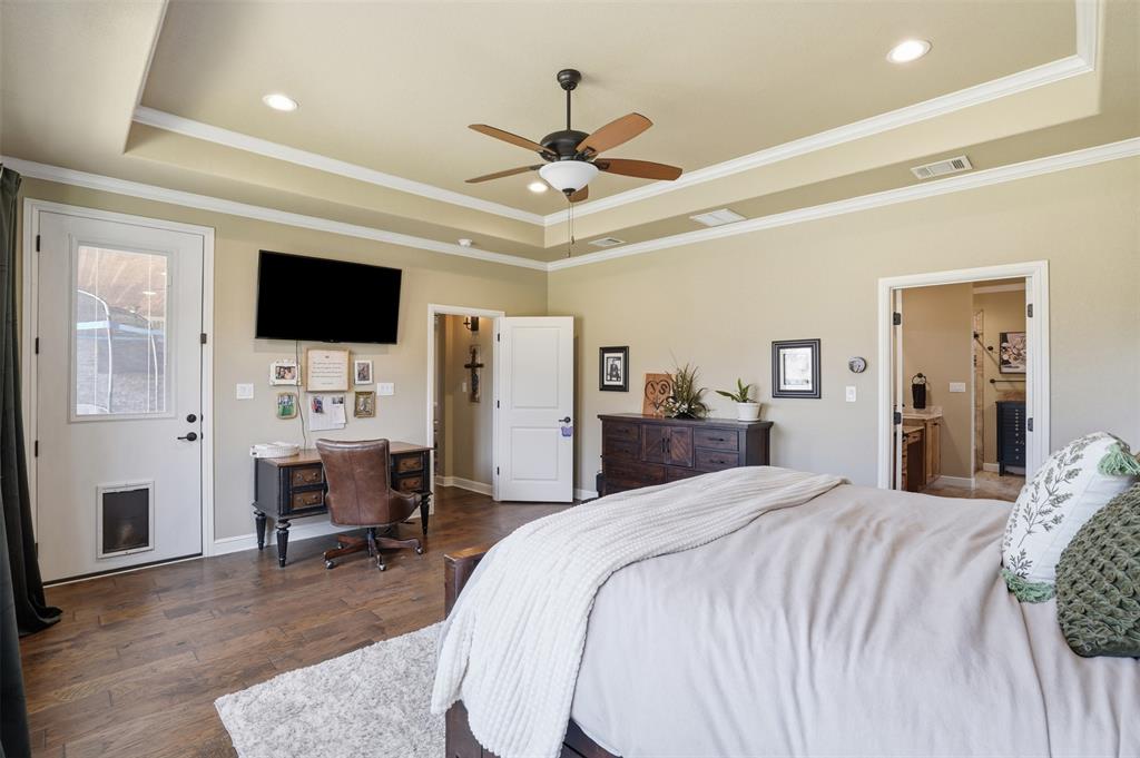 bedroom is open and airy with access to back porch. bedroom is open and airy with access to back porch.