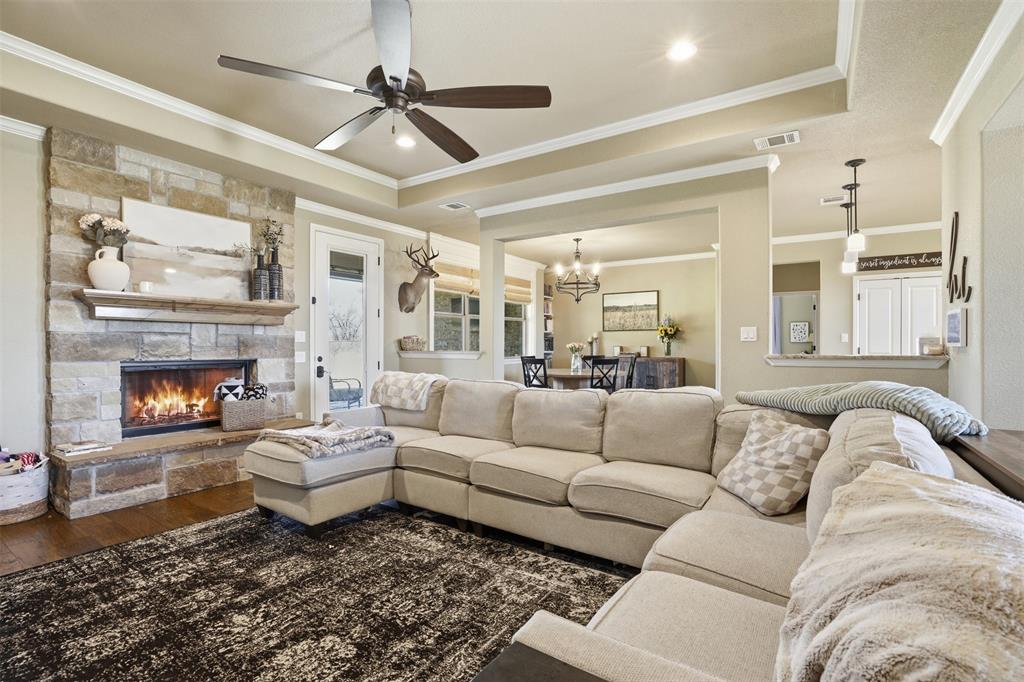 Wood burning fireplace in living room adds to the charm.