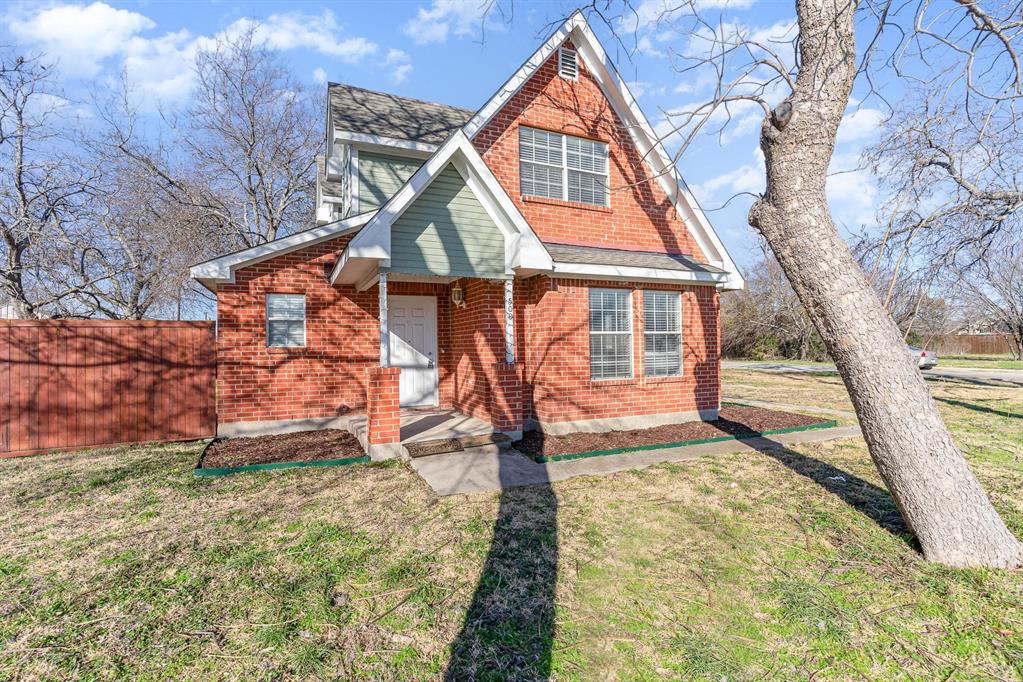 Brick exterior with a peaked roofline and gabled accent