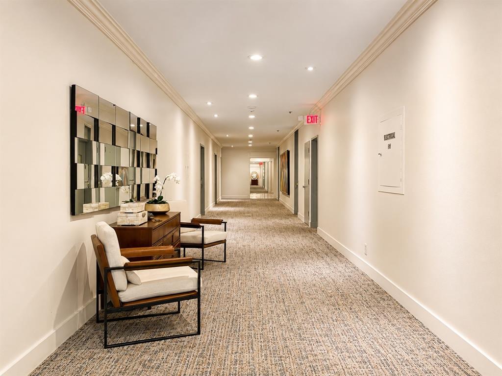 First floor view from main lobby down hallway to elevator lobby.