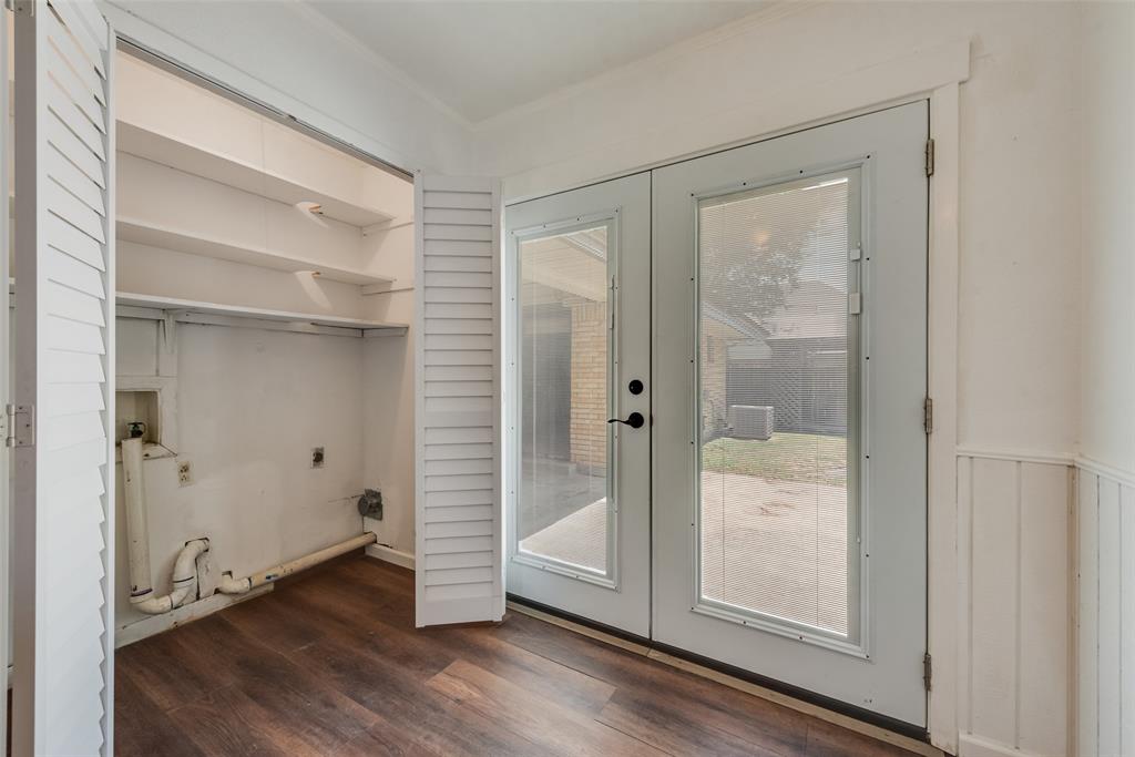Laundry closet with pantry above and doors leading to backyard patio