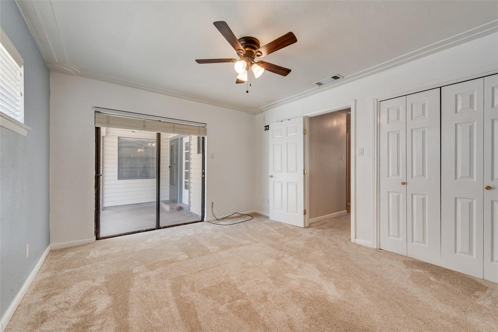 Primary bedroom with access to backyard covered patio