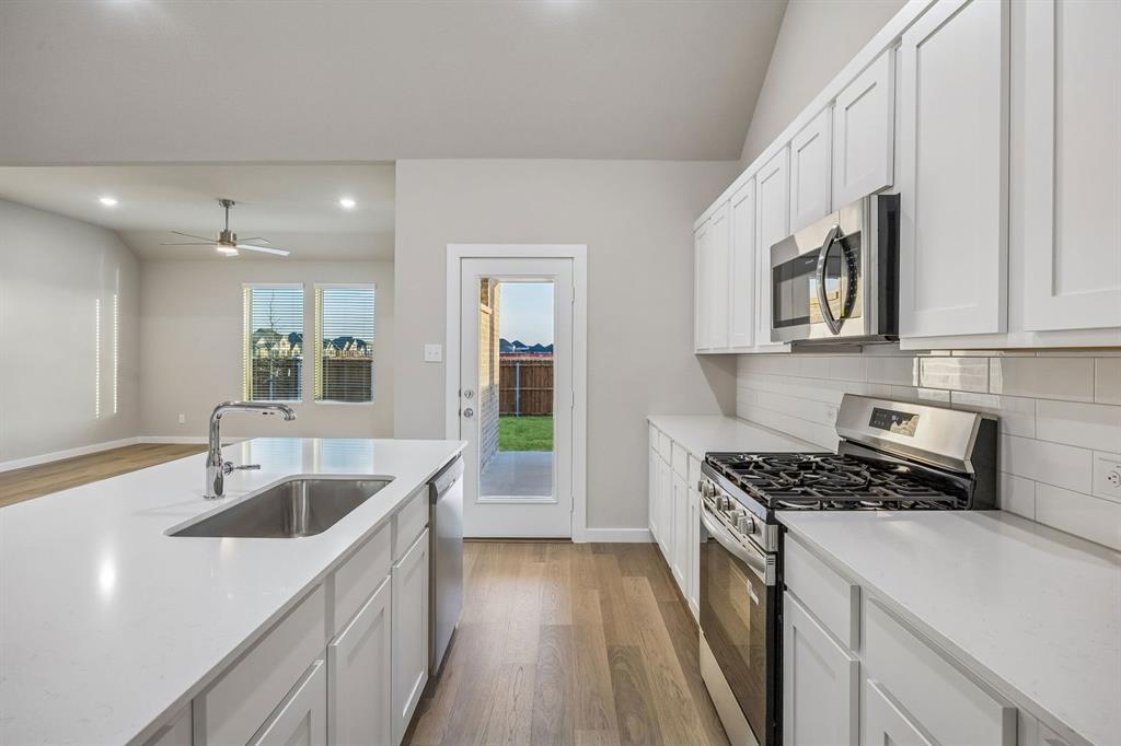 Kitchen in the Wimbledon home plan by Trophy Signature Homes – REPRESENTATIVE PHOTO Kitchen in the Wimbledon home plan by Trophy Signature Homes – REPRESENTATIVE PHOTO