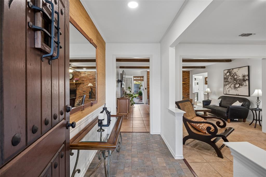 Entryway featuring a studded wood door with iron detailing.