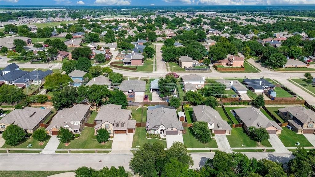 Aerial perspective showcasing a residential neighborhood with numerous single-story homes