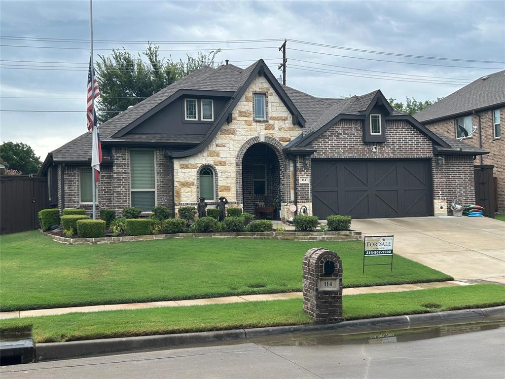 Stone and brick exterior with dark trim accents
