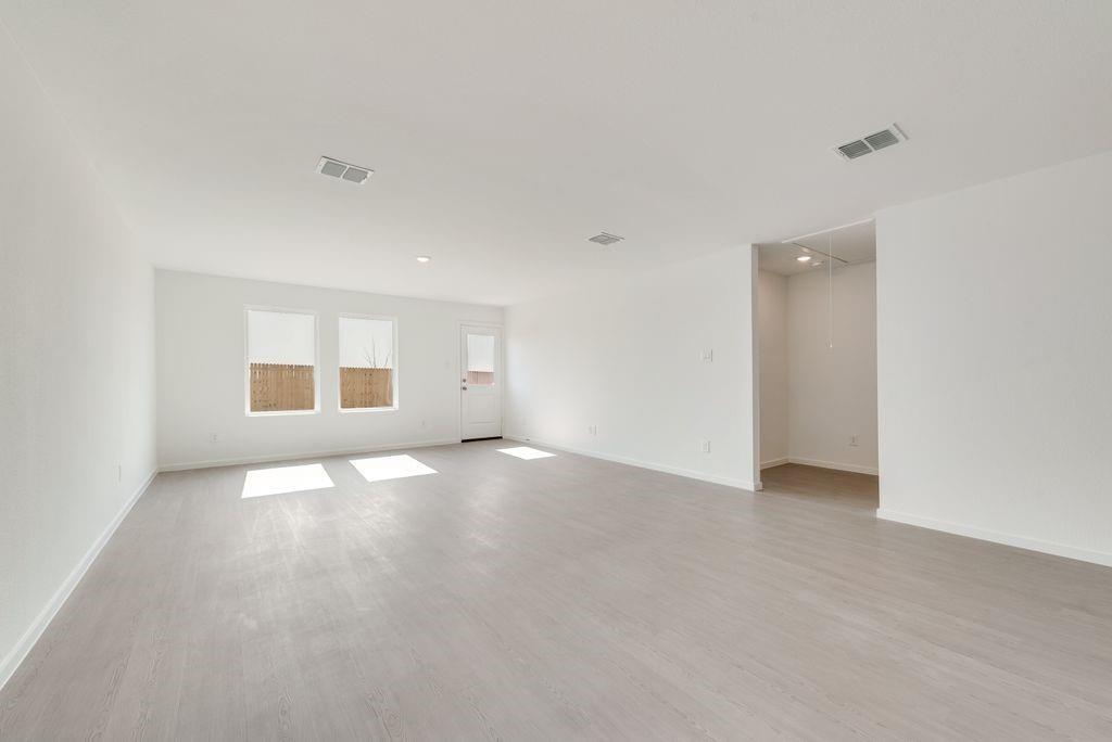 Spare room featuring wood finished floors