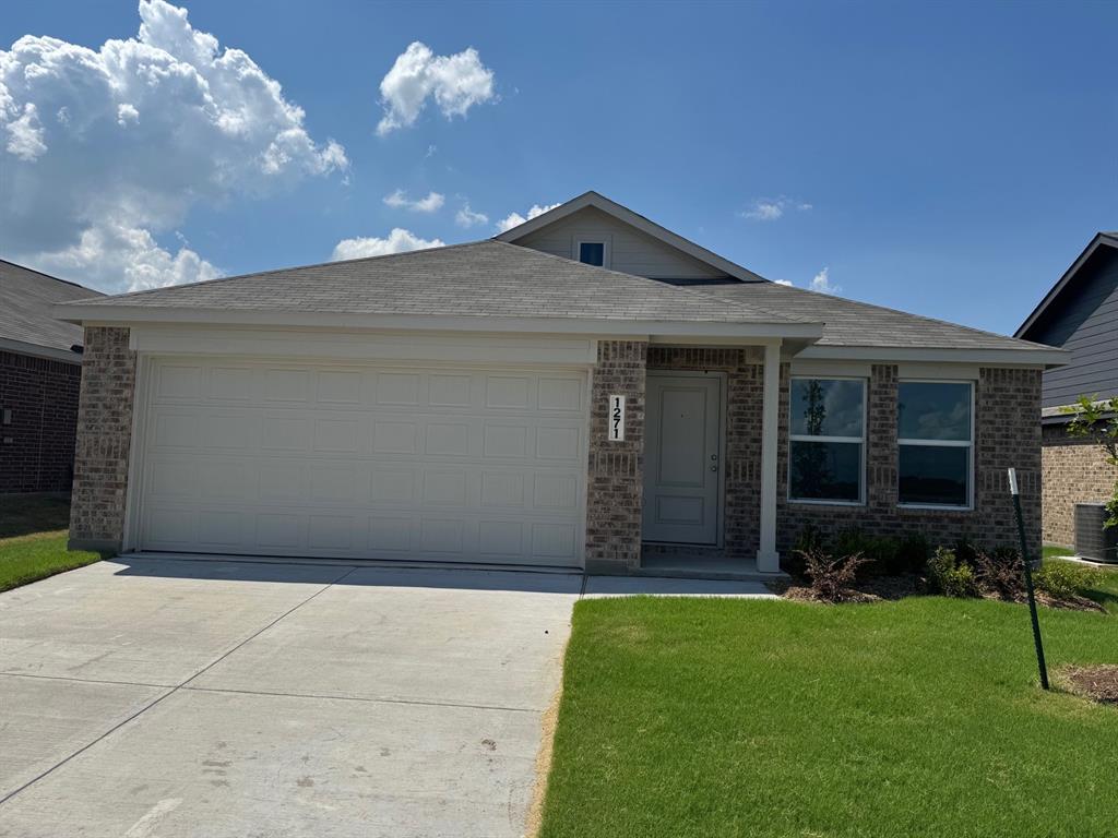 Single story home featuring brick siding, concrete driveway, a front lawn, and a garage Single story home featuring brick siding, concrete driveway, a front lawn, and a garage