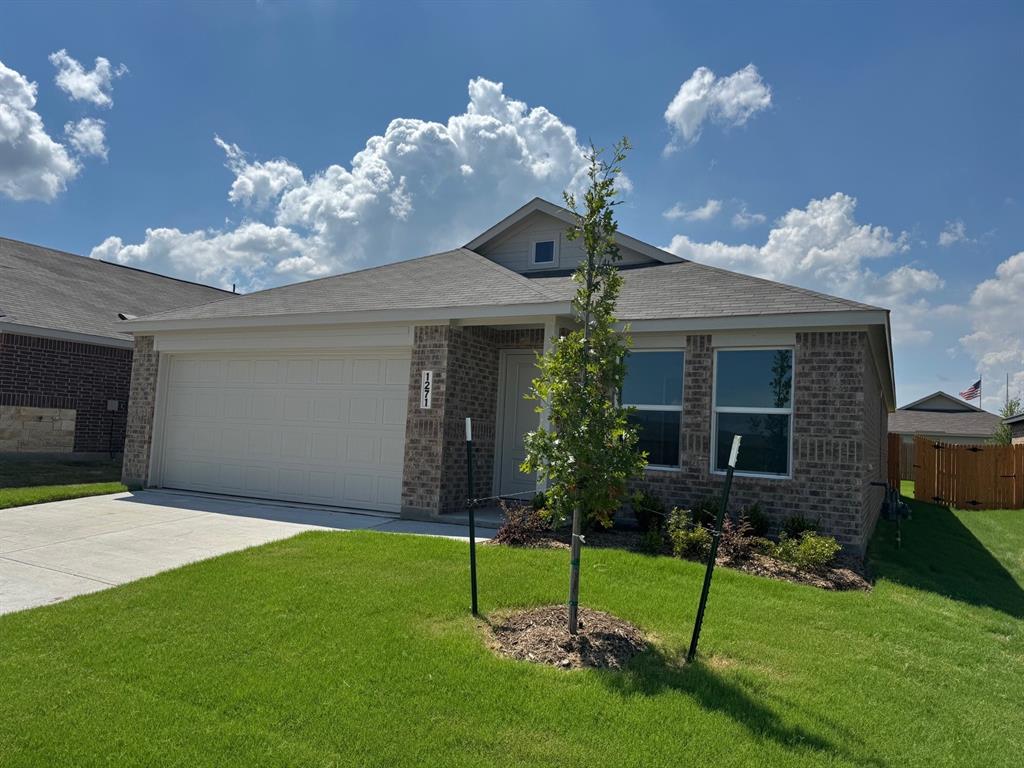 View of front of home featuring concrete driveway, brick siding, and a garage View of front of home featuring concrete driveway, brick siding, and a garage