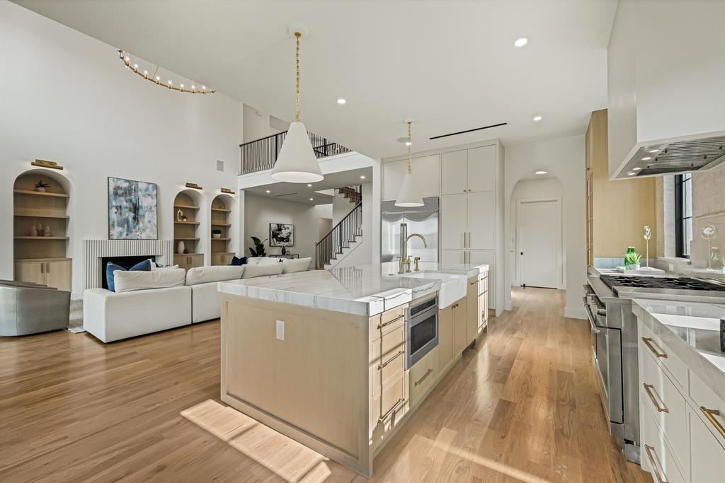 Open-concept main living area with wood-finish flooring