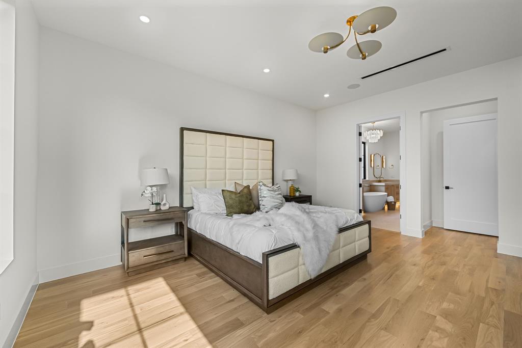 Light wood-finish flooring complements the neutral wall tones