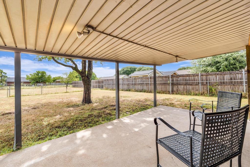 Covered Patio overlooks back yard