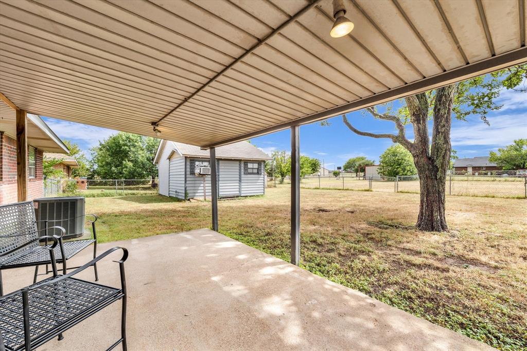 Covered Patio overlooks back yard