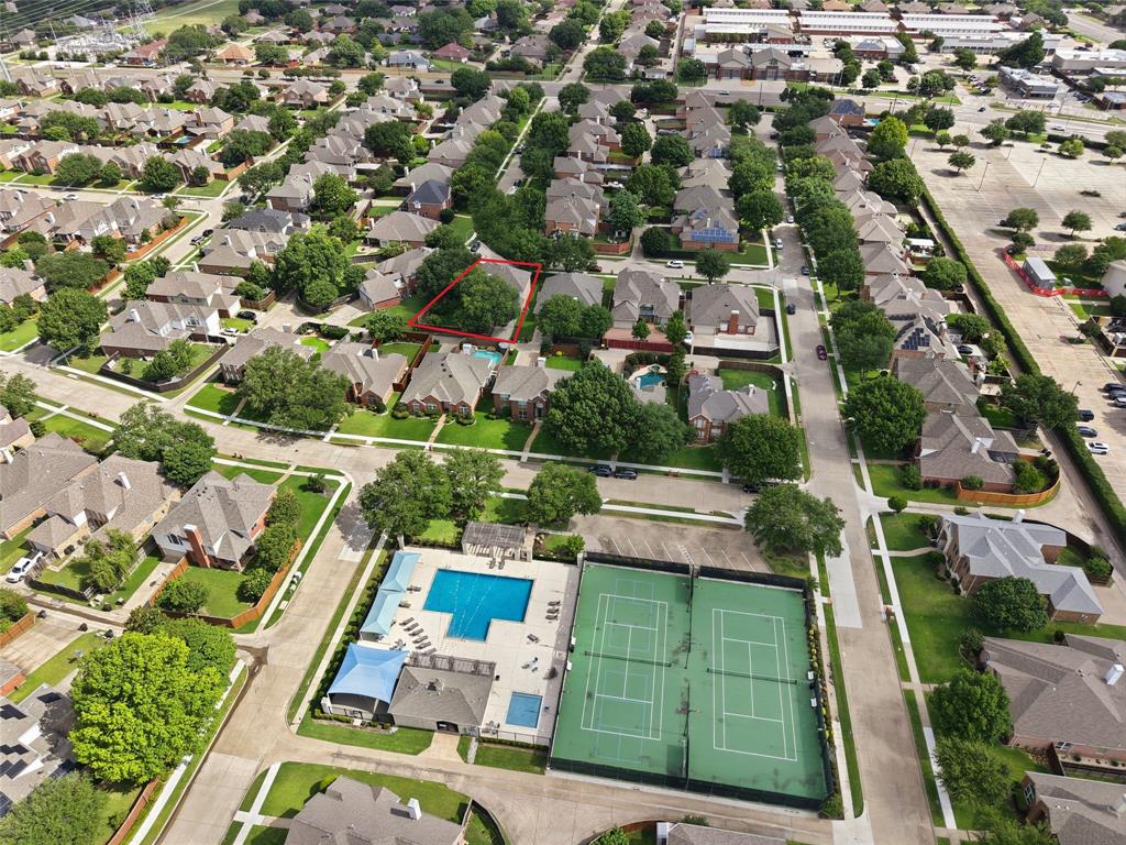 Aerial perspective highlighting a residential neighborhood with tree-lined streets Aerial perspective highlighting a residential neighborhood with tree-lined streets