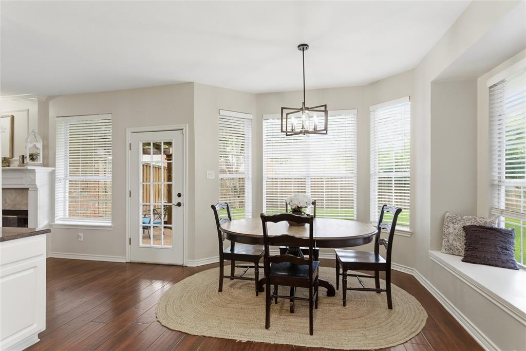 Dining area featuring wood-finish flooring and a built-in window seat