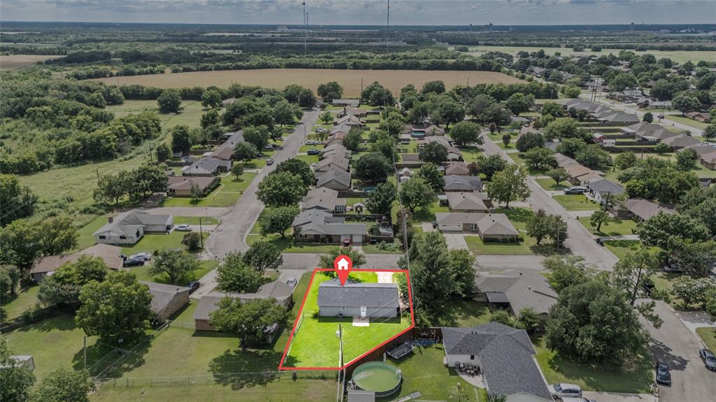 Aerial perspective showcasing the property within a residential neighborhood