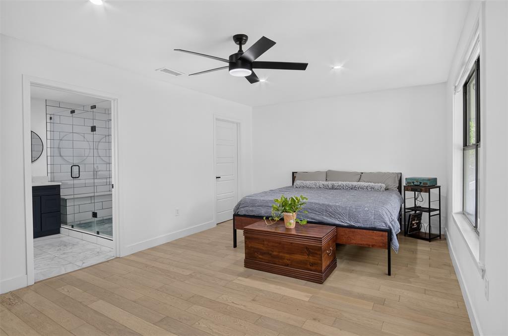 Primary bedroom with large luxury bathroom.