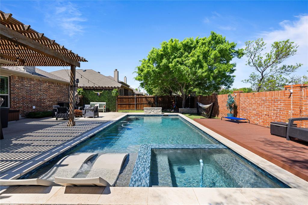 View of swimming pool with a patio area and a pergola