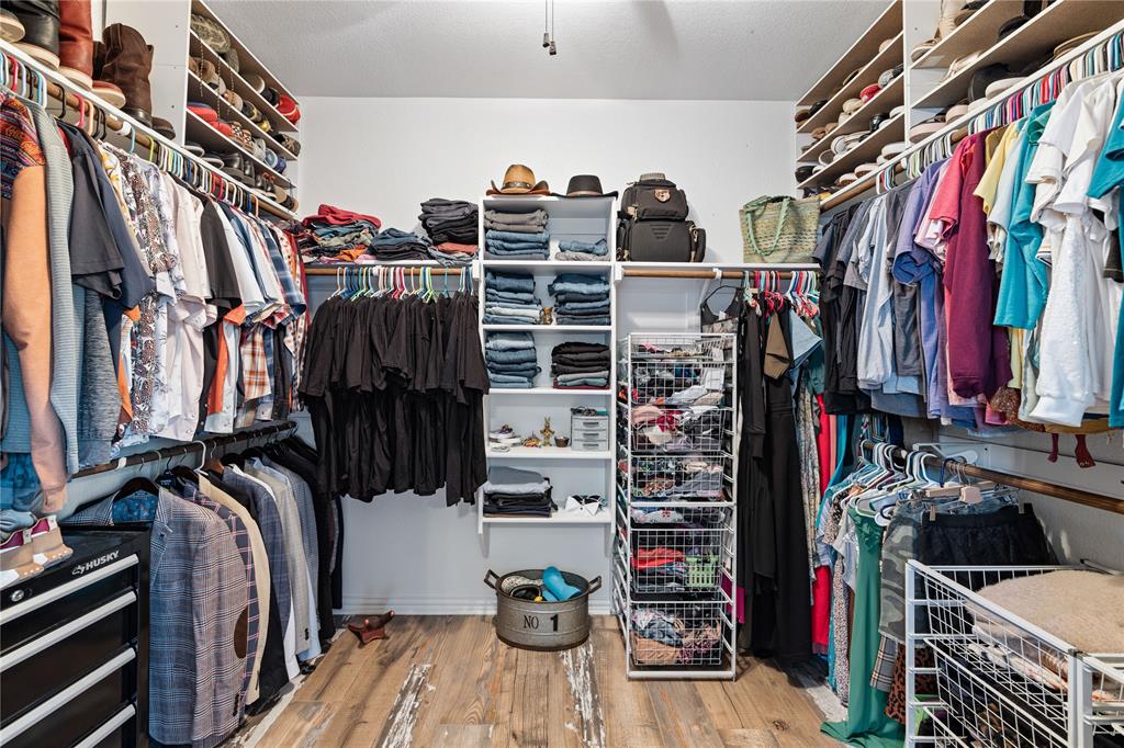 Spacious closet with light wood-type flooring