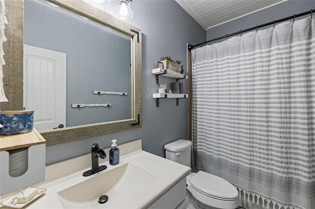 Bathroom featuring vanity and toilet